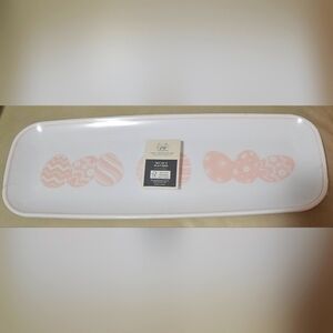 Set of 3 platters with the print of pastel pink easter eggs on it.